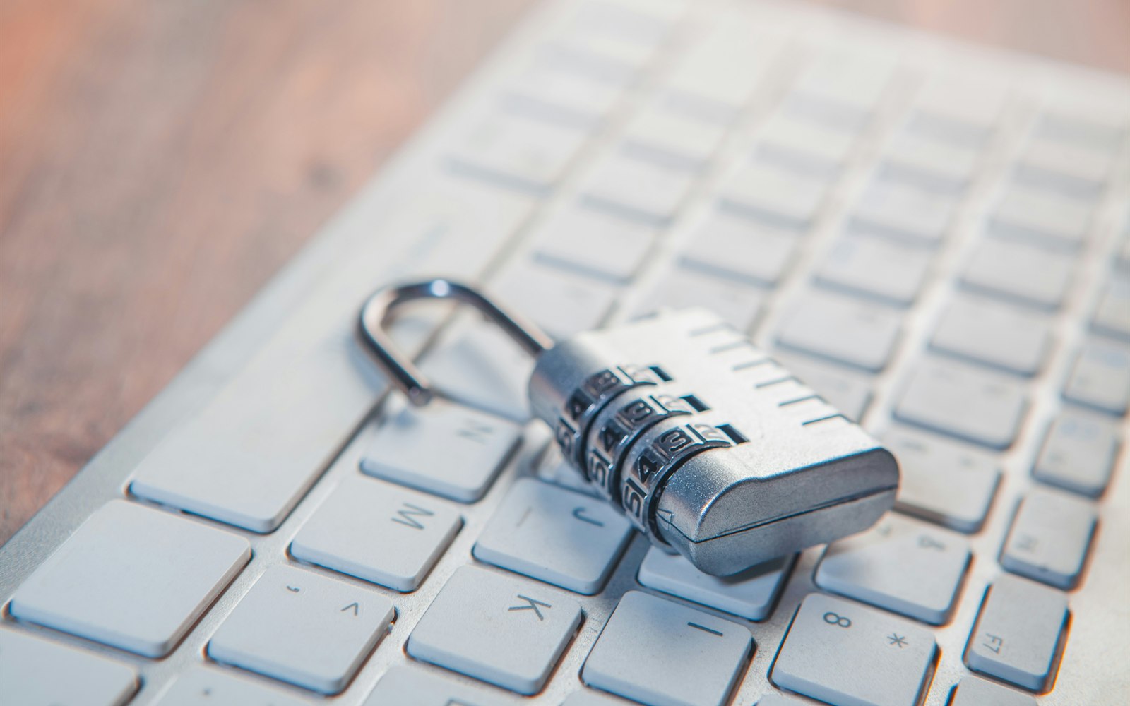 Combination lock resting on a computer keyboard